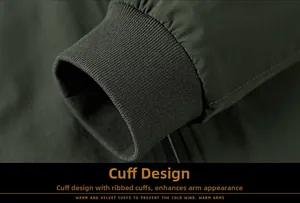 Detail of dark green outdoor jacket sleeve showing windproof elastic ribbed cuff design
