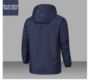 Rear view of a men's waterproof hooded windbreaker jacket in deep denim blue color