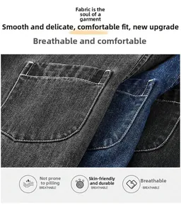 Detailed close-up of textured denim shirt fabric showing durable stitching and twill weave