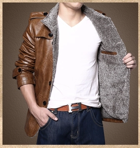 Detailed macro view of brown crocodile texture PU jacket with thick grey faux fur lining