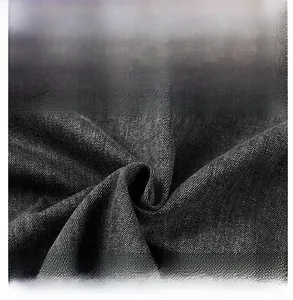 Detail showing the breathable twill texture and fabric structure of the denim shirt