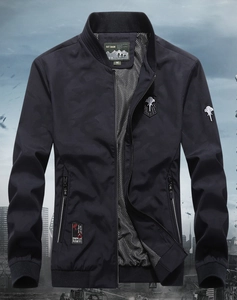 Detail of navy camo bomber jacket showing rib-knit cuffs and technical fabric texture