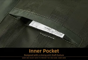 Detailed close-up of dark green jacket inner anti-theft pocket with mesh lining