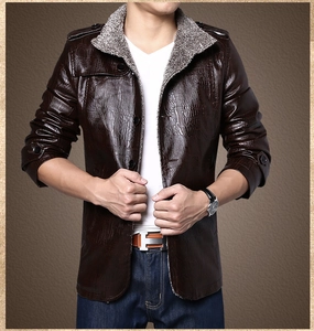 Detail of dark brown faux leather jacket with crocodile texture and grey fleece collar