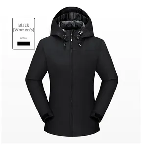 Close-up of black waterproof women's outdoor jacket with adjustable hood and velcro cuffs