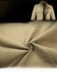 Detail of khaki cotton canvas jacket showing epaulettes, stand collar and flap pockets