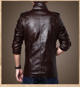 Detail of dark brown faux leather jacket with crocodile texture and back seam design