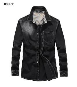 Close-up of black denim shirt featuring collar lining with artistic pattern and chest pocket