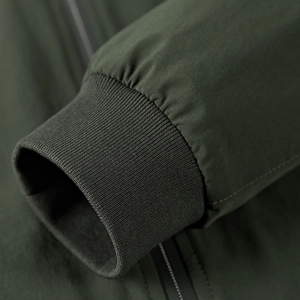Men's outdoor army green stretch jacket with premium ribbed cuffs and metal zipper details