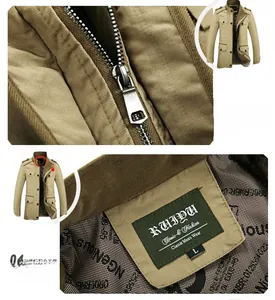 Detailed macro view of the metal zipper and woven brand label on the khaki business jacket