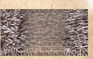 Close-up of washing care label on a plush fleece lining of a men's winter leather jacket