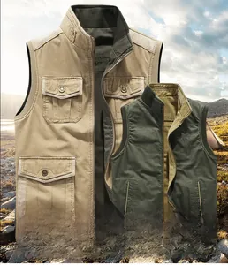 Detail of a double-sided cotton vest showing khaki and dark green utility pockets and zippers