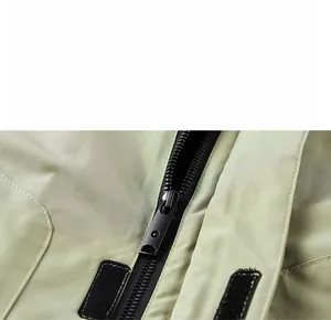 Detail of high-quality resin zipper and durable fabric on military cargo jacket
