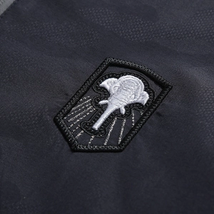 Men's casual camouflage cotton jacket with detailed elephant embroidery on dark twill fabric