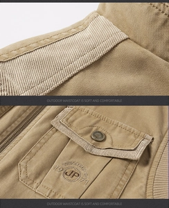Detailed close-up of khaki twill cotton vest showing premium stitching and utility pockets