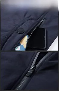 Détail de la poche zippée étanche du gilet de pêche montrant la profondeur et les finitions