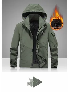 Detail of military green hooded jacket with warm black flannel lining and mountain patch