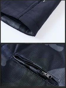 Détail de gilet avec doublure camouflage réversible et poche à fermeture éclair
