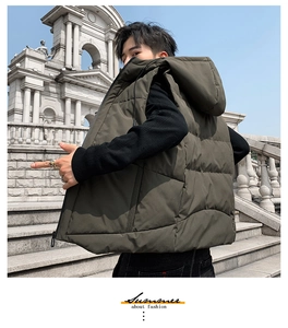 Detail of olive green hooded puffer vest featuring horizontal quilting and drawstrings