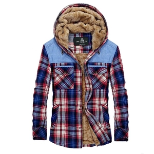 Detail of red plaid hooded flannel shirt with warm brown fleece lining and denim shoulders
