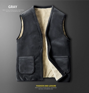 Detail view of dark gray vest with warm beige faux lamb wool lining and square pockets