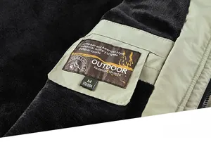 Detail view of thick black fleece lining and embroidered labels on men's outdoor jacket