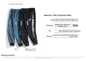 Detail view of cargo pants featuring multi-pocket design and ribbed cuffs in mist blue