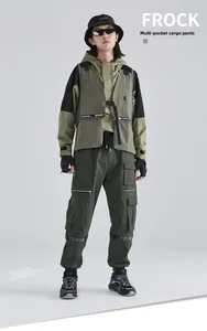 Detail of dark green techwear cargo pants featuring multi-pockets and webbing straps