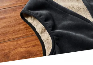 Detail of windproof ribbed cuffs and thick faux sheepskin lining on winter vest