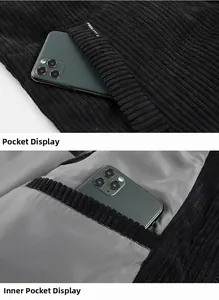 Detail showing the deep pockets and inner lining of a black corduroy winter vest