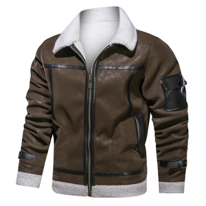 Detail of dark brown leather flight jacket with plush white faux shearling lining