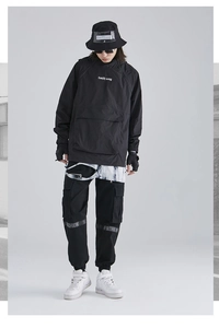 Detail of black techwear cargo set with Earth Song print and multi-pocket design