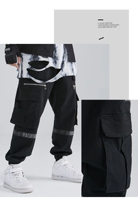 Detail of multi-pocket cargo pants showing durable stitching and fashion ribbon decor