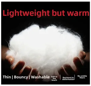 Close-up of white fluffy down-cotton filling showing its light and bouncy texture
