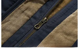 Detailed close-up of heavy-duty metal zipper and warm fleece lining on outdoor jacket