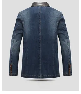 Detail of denim blazer back with vertical stitching and brown leather collar accent