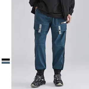 Men's blue-grey cargo pants with functional multi-pockets and contrast stitching detail