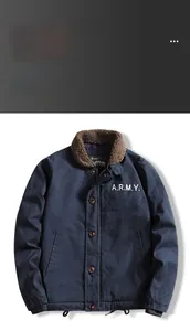 Detail of navy blue flight jacket featuring faux shearling collar and white ARMY print
