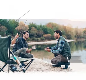 Detail view of multi-pocket denim fishing vest and cargo pants for outdoor activities