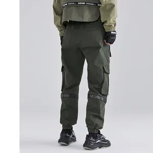 Men dark green cargo pants with fashion straps and functional pockets in street style