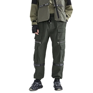 Men's olive green multi-pocket cargo pants in tactical techwear style for outdoors