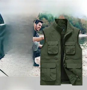 Detail of a dark green outdoor multi-pocket fishing vest with black breathable mesh lining