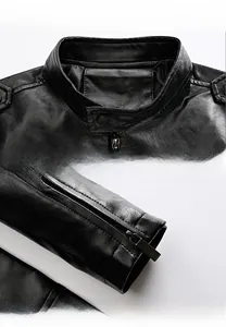 Detail view of the black leather jacket featuring a stand-up collar and metal zipper cuffs