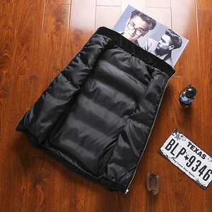 Men's black quilted velvet vest featuring a warm lining and smooth zipper closure