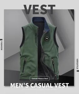 Detail of forest green fleece vest featuring a stand collar and outdoor mountain badge