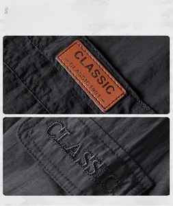 Detail view of water-resistant jacket showing brown leather label and ripstop fabric texture