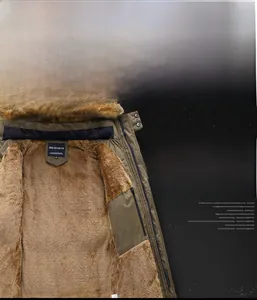 Detail of army green winter coat with warm faux fur lining and plush collar for men