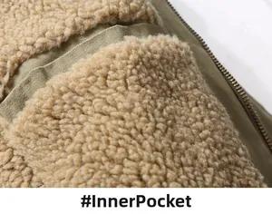Macro shot of the warm sherpa fleece lining and functional inner zipper pocket of the jacket