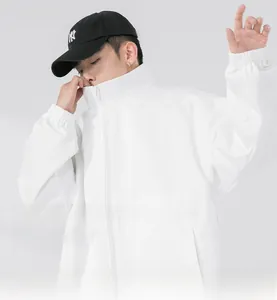 Detail of men's white stand-collar jacket featuring a smooth zipper and elastic cuffs