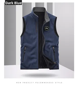 Close-up of men's navy blue fleece vest featuring a mountain badge and full zip closure